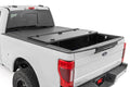 Hard Tri-Fold Flip Up Bed Cover | 6'10" Bed | Ford F-250/F-350 Super Duty (17-26) - The Suspension Specialists