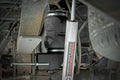 Air Spring Kit w/compressor | Ford F-250/F-350 Super Duty 4WD (2005-2016) - The Suspension Specialists
