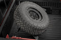 Bed Mount Spare Tire Carrier | Universal (5x5.5 6x5.5 6x135 & 5x5.0 Bolt Patterns) - The Suspension Specialists