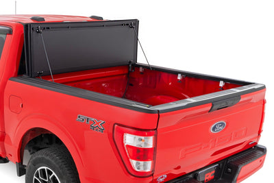 Hard Tri-Fold Flip Up Bed Cover | 5'7" Bed | Ford F-150 2WD/4WD (2015-2020) - The Suspension Specialists