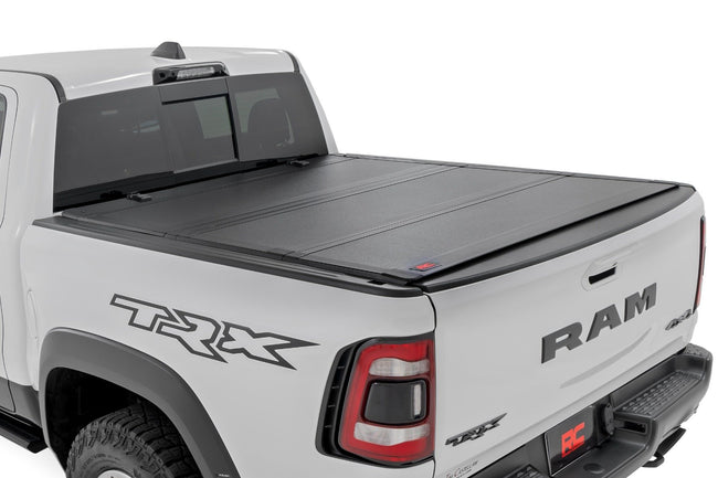 Hard Tri-Fold Flip Up Fold Bed Cover | 5'7" Bed | Ram 1500 (19-26)/1500 TRX (21-24) - The Suspension Specialists