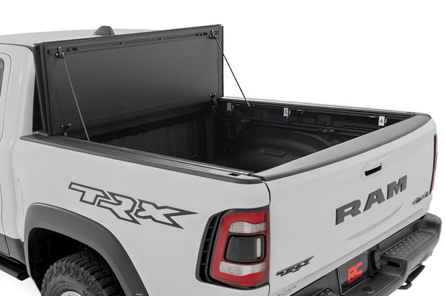 Hard Tri-Fold Flip Up Fold Bed Cover | 5'7" Bed | Ram 1500 (19-26)/1500 TRX (21-24) - The Suspension Specialists