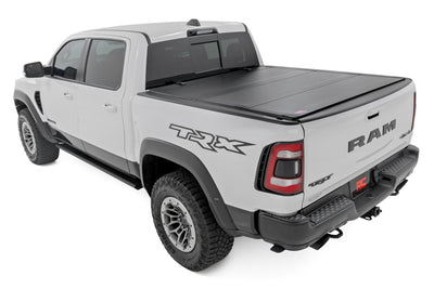 Hard Tri-Fold Flip Up Bed Cover | 6'4" | Ram 1500 (19-26)/1500 TRX (21-24) - The Suspension Specialists
