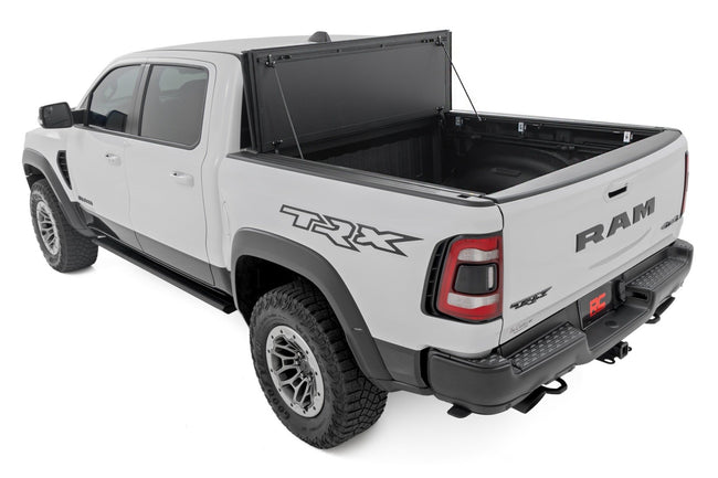 Hard Tri-Fold Flip Up Bed Cover | 6'4" | Ram 1500 (19-26)/1500 TRX (21-24) - The Suspension Specialists