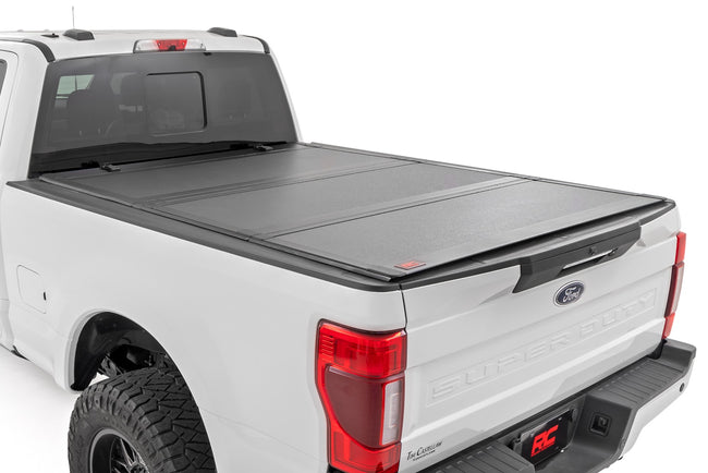 Hard Tri-Fold Flip Up Bed Cover | 6'10" Bed | Ford F-250/F-350 Super Duty (17-26) - The Suspension Specialists
