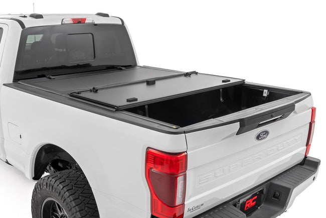 Hard Tri-Fold Flip Up Bed Cover | 6'10" Bed | Ford F-250/F-350 Super Duty (17-26) - The Suspension Specialists