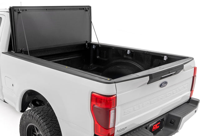 Hard Tri-Fold Flip Up Bed Cover | 6'10" Bed | Ford F-250/F-350 Super Duty (17-26) - The Suspension Specialists
