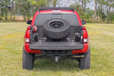 Bed Mount Spare Tire Carrier | Universal (5x5.5 6x5.5 6x135 & 5x5.0 Bolt Patterns) - The Suspension Specialists